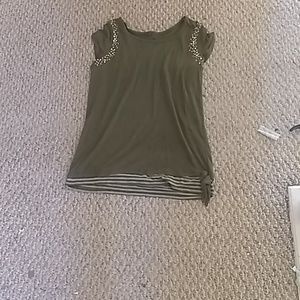 A green shirt with sequin on the sleeves